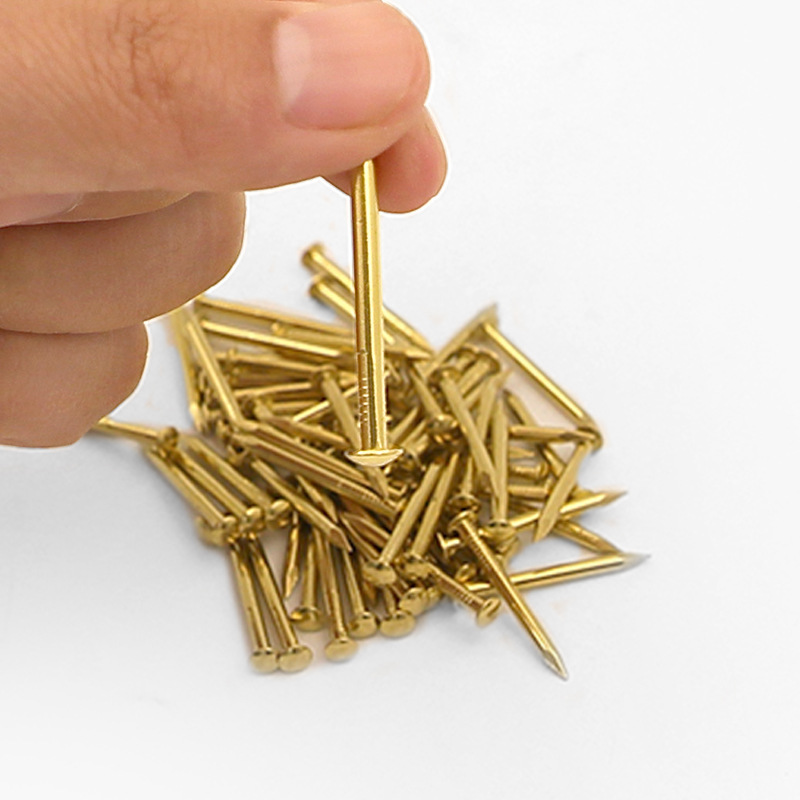 Small nails, small sizes, mini copper nails, round heads, copper nails, brass wood, round nails, brass nails, woodworking, golden nails, fine details Picture