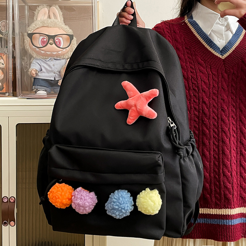 Minimalist style backpack, light and casual commuting style, trendy minimalist backpack, cute pom-pom girl style backpack full figure