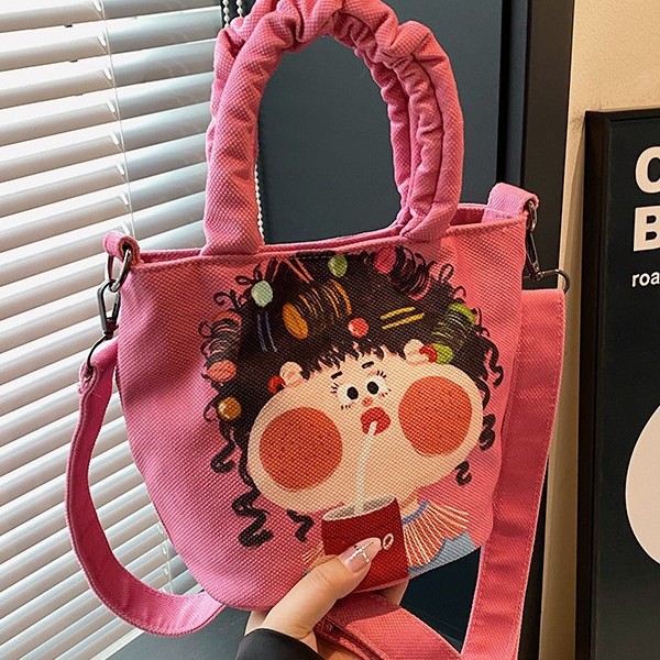 The popular cartoon graffiti bucket bag for autumn and winter 2024 is a cute new fashionable handbag and a versatile cartoon shoulder bag Item Picture