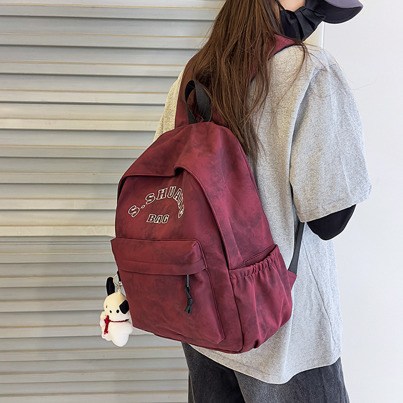 Korean InS-style solid color letter backpack 2025, Japanese Harajuku simple and versatile college student schoolbag for women full figure