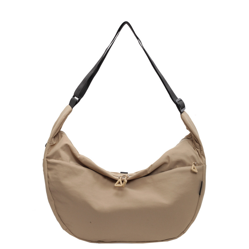 Large-capacity commuting crossbody canvas bag for women, new autumn/winter 2024, casual and versatile student dumpling bag Item Picture