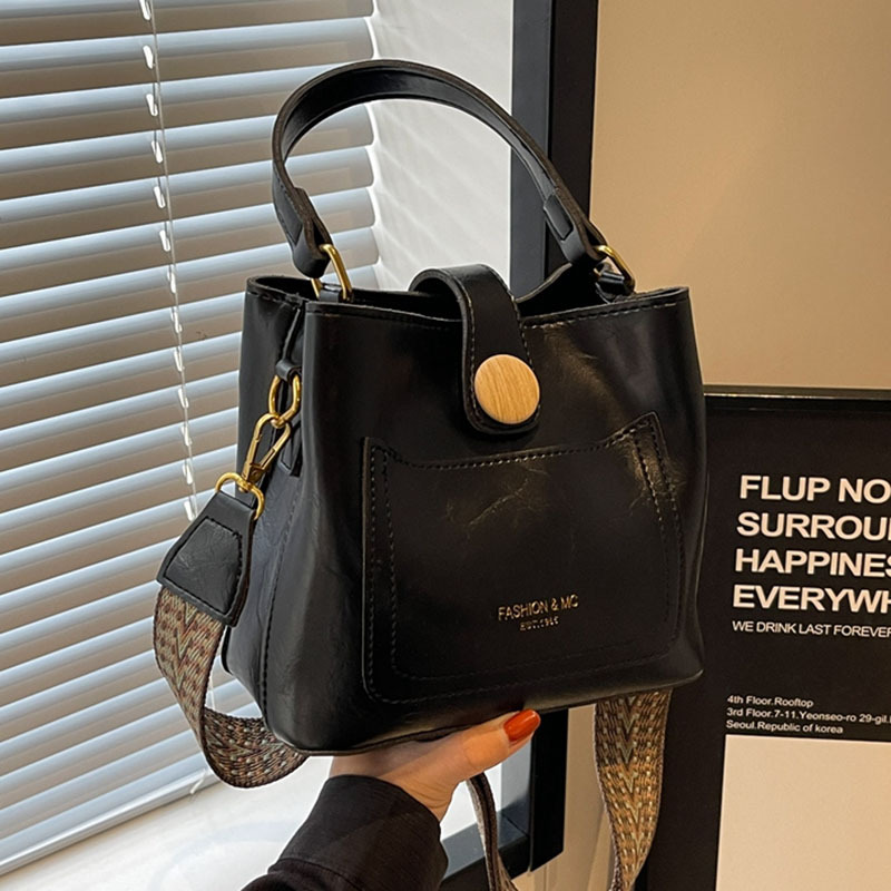 Bucket bag for women 2023 new style, solid color, high-end, retro, niche, wide-shoulder crossbody bag, hand-held small bag full figure