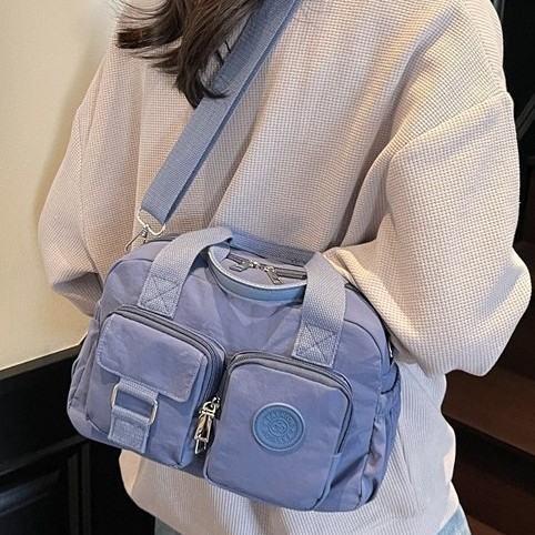 Spring/Summer New 2025 Fashionable, versatile, casual and simple nylon fabric hand-held multi-pocket workwear-style single-shoulder crossbody bag full figure