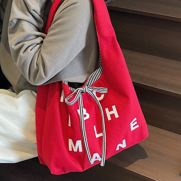 Large-capacity color-blocking striped double-sided canvas bag, 2025 new style color letter bow shopping bag, single-shoulder bag full figure