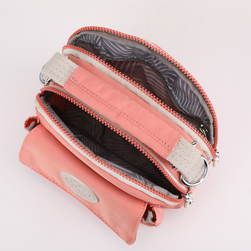 New cross-border women's fashion and trend crossbody bag, Japanese style simple water repellent bag, lipstick, loose change portable handbag Application Scenario