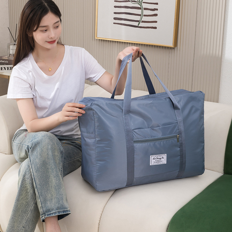 Travel bag for women, short-distance hand-held, large-capacity moving, bedroom storage bag, clothes storage bag, business trip storage bag Application Scenario