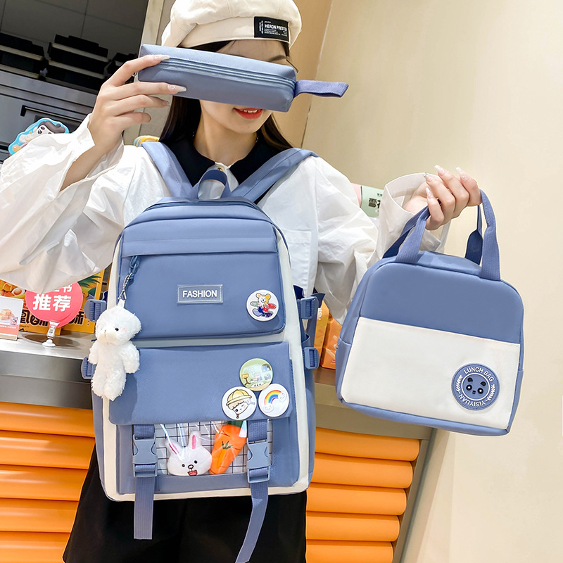 Wholesale of campus student schoolbags in stock, Korean version large-capacity girls' backpacks, lightweight and versatile casual backpacks full figure
