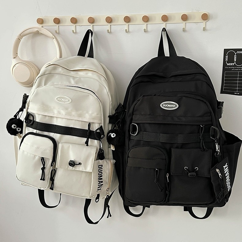 Japanese-style simple solid-color casual backpack, high appearance level, junior high school student schoolbag, large capacity, versatile, workwear-style backpack Application Scenario