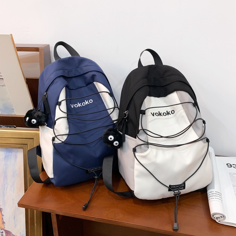 Cross-border color-blocking casual large-capacity backpack, simple and sporty style, trendy backpack for junior and senior high school students when going out Application Scenario