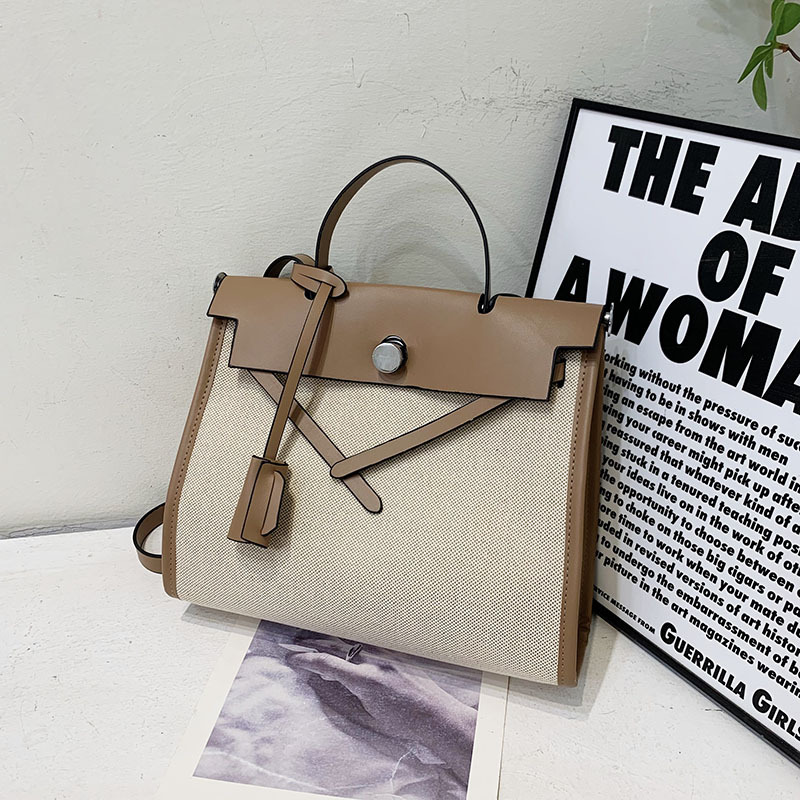 The 2024 new briefcase features a stylish color-blocking large bag with a French high-end texture. The Kelly bag is a versatile single-shoulder crossbody women's bag details Picture