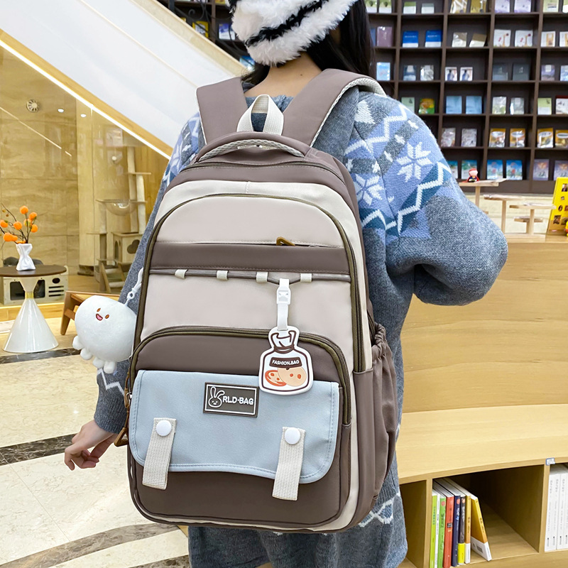 Wholesale of high school and junior high school students' schoolbags with high appearance level, color-matching to reduce burden, versatile, large-capacity backpacks, and cute girls' backpacks full figure