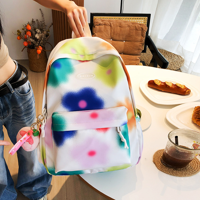 Cute flower junior high school student schoolbag, large-capacity tie-dyed colorful commuting backpack, niche design college student backpack details Picture
