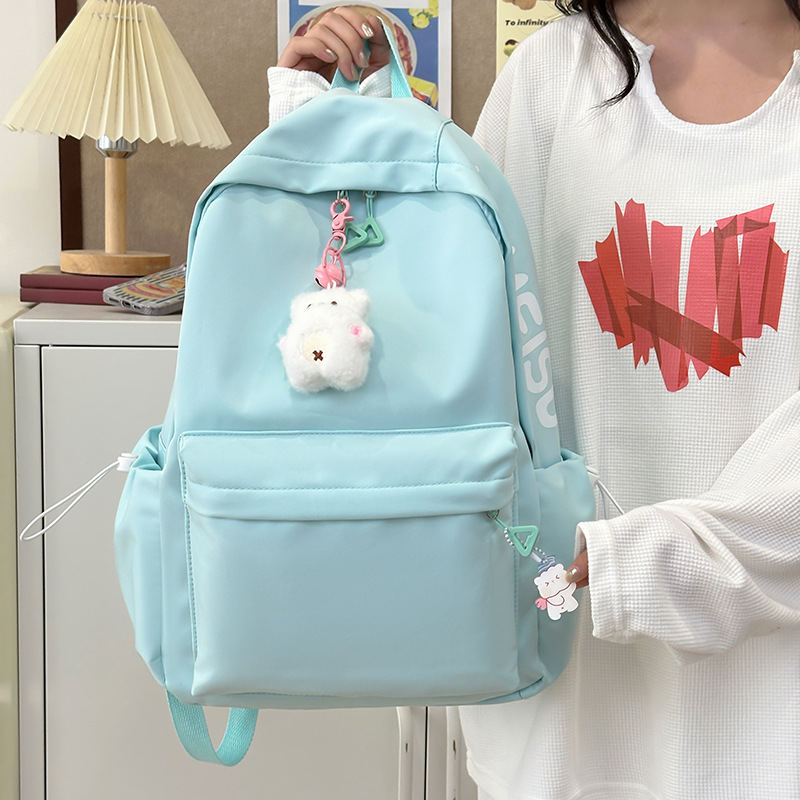 Simple foresty-style backpack with lettered schoolbag, new model for campus 2025, versatile for commuting, large capacity, solid color for going out full figure