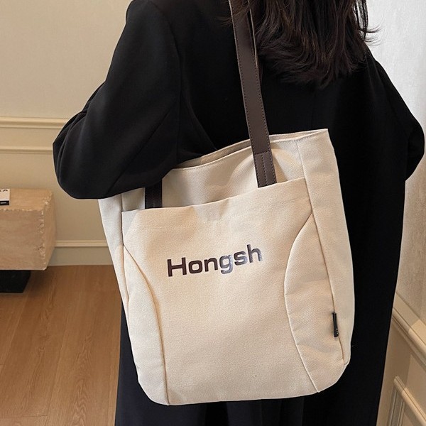 Korean-style fashionable casual color-blocking bag with letter print, high-end hand-held tote bag, color-blocking versatile single-shoulder bag Application Scenario