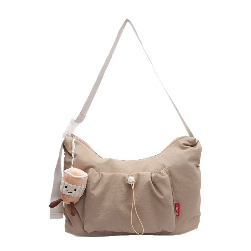 A new solid-color, girlish, large-capacity, sporty single-shoulder bag with a pleated drawstring design and a casual crossbody bag Item Picture