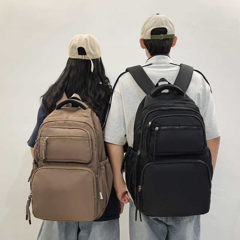 Nylon student schoolbags, large-capacity, dirt-resistant, simple, high-appearance-level backpacks, lightweight short-distance travel backpacks, computer bags full figure