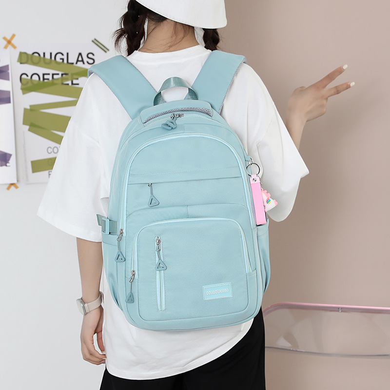 A new large-capacity schoolbag for junior and senior high school students, a high-end solid-color casual backpack for women, and a multi-layered travel bag trend details Picture