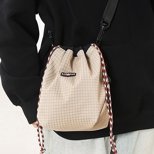 A new style of small shoulder bag with a unique drawstring neckline, a distinctive single-shoulder phone bag, a workwear Japanese-style small bag Application Scenario