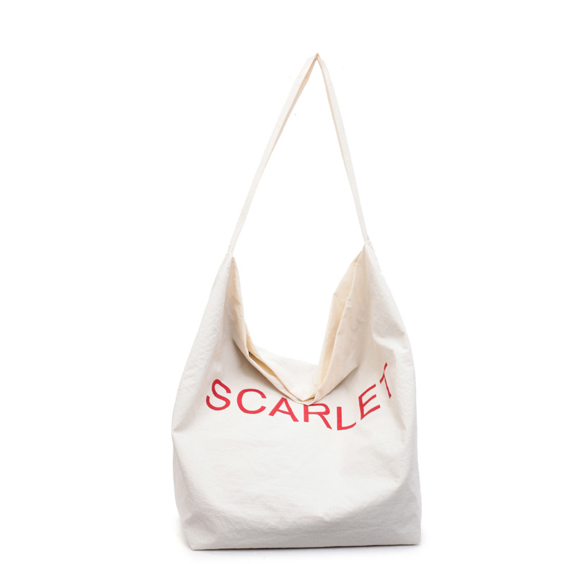 A new large-capacity Korean spring and summer designer's simple printed letter fabric bag, a versatile and niche single-shoulder bag for women on Instagram Item Picture