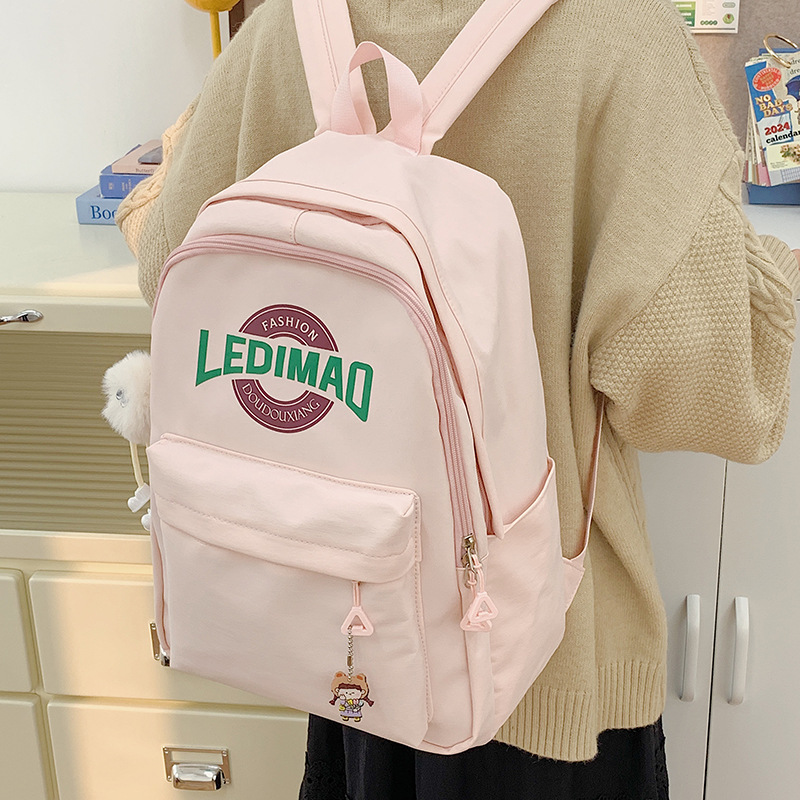 The new winter schoolbag is in the style of Harajuku for primary and secondary school birthdays, a fresh and light backpack, and a forest-themed college student travel backpack details Picture