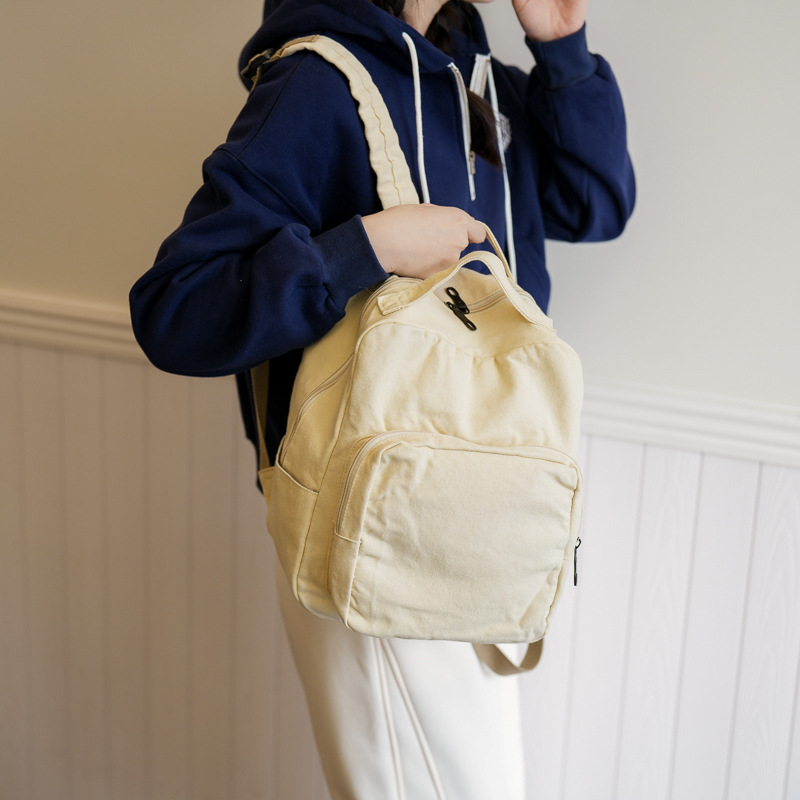 A simple solid-color backpack for Japanese high school and college students, a washable and aged canvas bag, and a retro travel backpack full figure