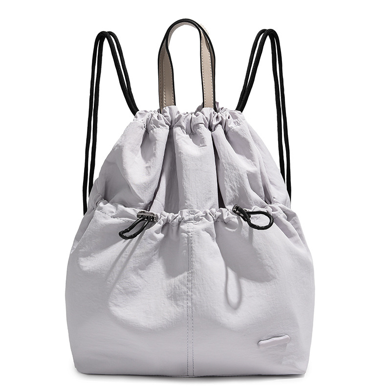 A new 2024 fashionable student backpack for women, a casual Korean-style backpack with drawstring pockets, and a travel bag Item Picture