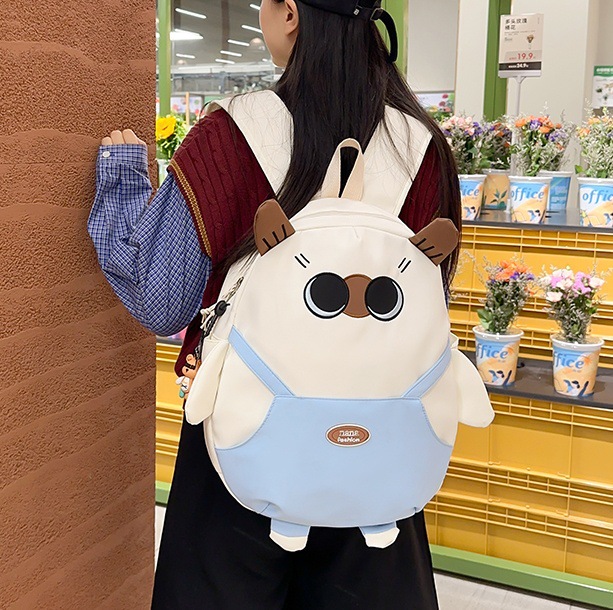 A fresh, unique and funny backpack for a girl with a color-blocking cartoon and cute girl. It's a backpack for traveling and outings full figure