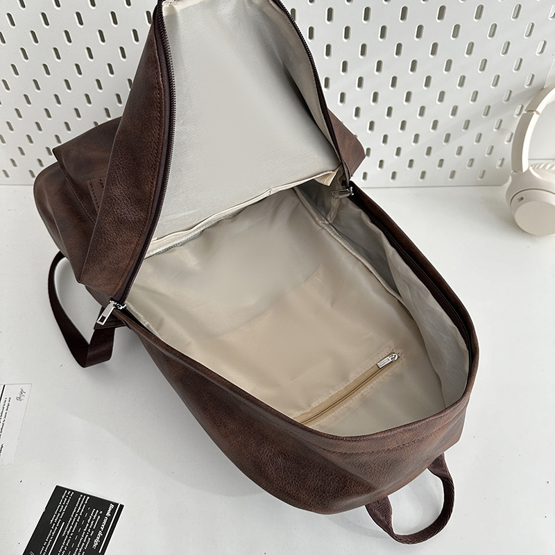 Hong Kong-style retro backpack for autumn and winter, new simple PU large-capacity student schoolbag, versatile travel and leisure backpack Application Scenario