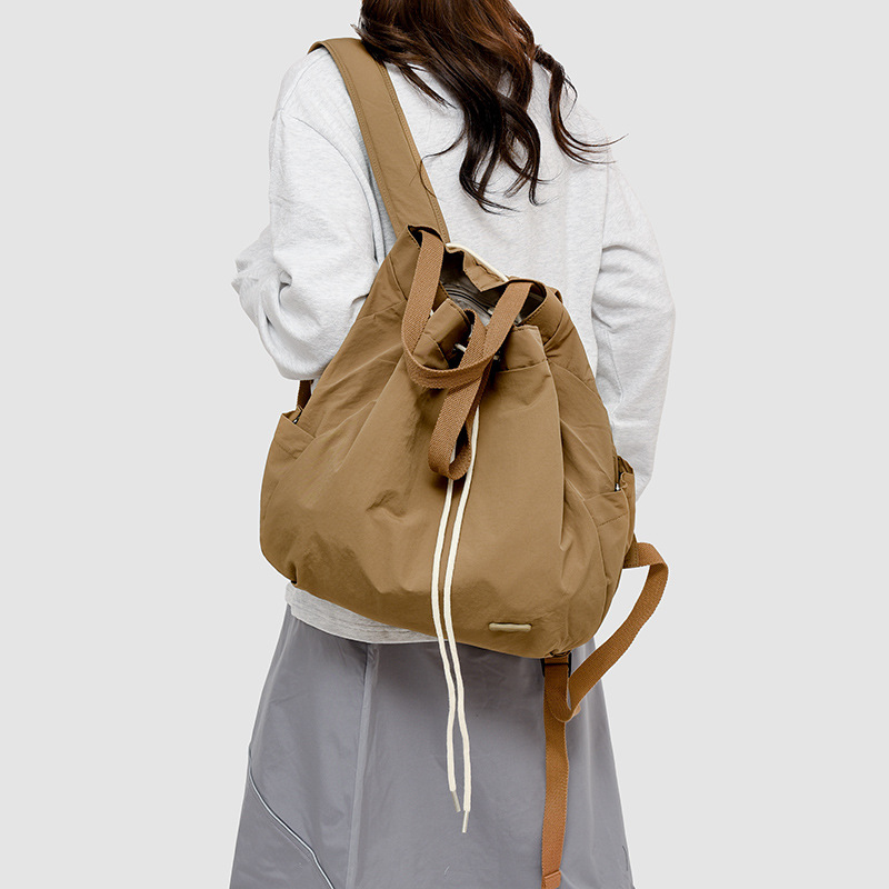 A versatile and fashionable drawstring backpack for women, a new 2024 niche casual Instagram simple commuting bag, a lightweight small bag details Picture