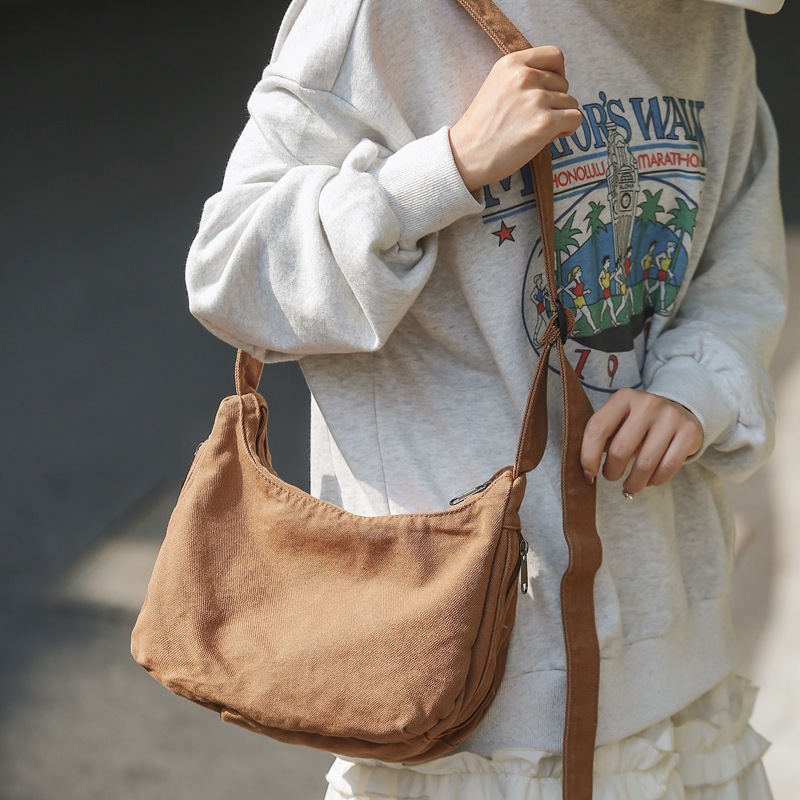 Canvas dumpling bag 2024 New style ins single-shoulder bag for women, laid-back casual crossbody bag, solid color retro small backpack full figure