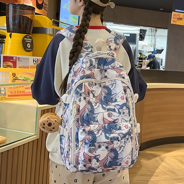 Trendy graffiti schoolbags for junior high school girls and senior high school students, large-capacity cute cartoon backpacks, and niche Instagram backpacks for girls full figure