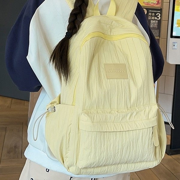 A fresh and clean backpack with a solid color and a simple school style for girls. It is a travel backpack for junior and senior high school students and a study tour bag full figure