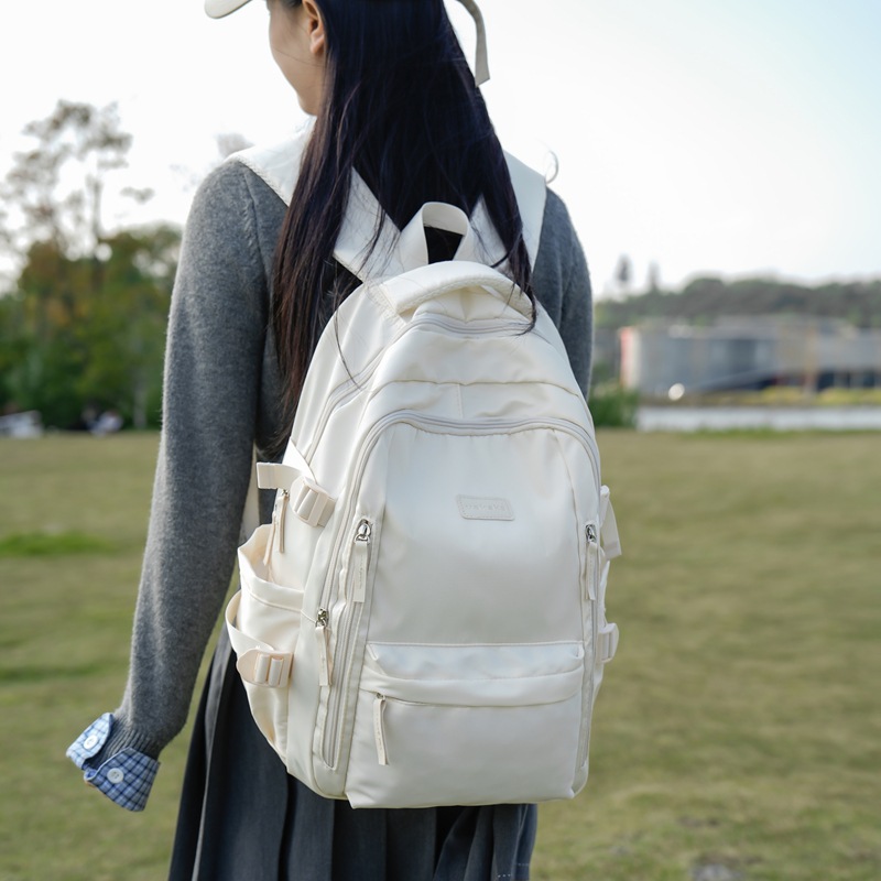 This Japanese-style, Instagram-style, simple campus high school student backpack is a solid-colored girl's Harajuku style versatile backpack full figure