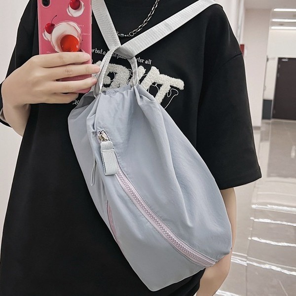 The new personalized large-capacity crossbody bag is simple and versatile. It features a solid-color niche design, a single-shoulder bag, and a casual multi-purpose backpack full figure