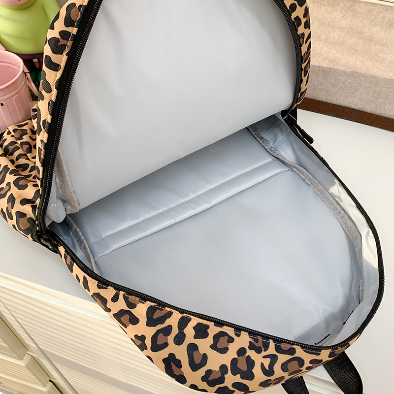 A cute Korean-style schoolbag with a niche design, featuring cartoon leopard print and a large capacity backpack for high school and college students Application Scenario