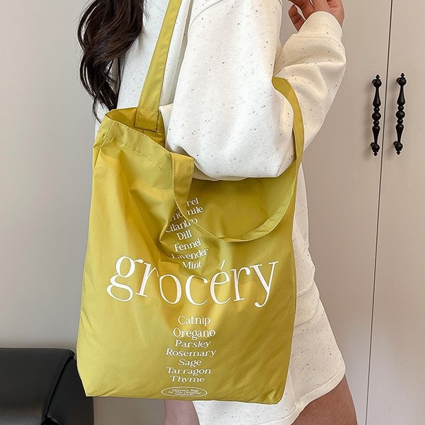 Korean sweet and simple canvas hand-held shoulder bag, student portable large-capacity lettered casual shopping canvas bag Application Scenario