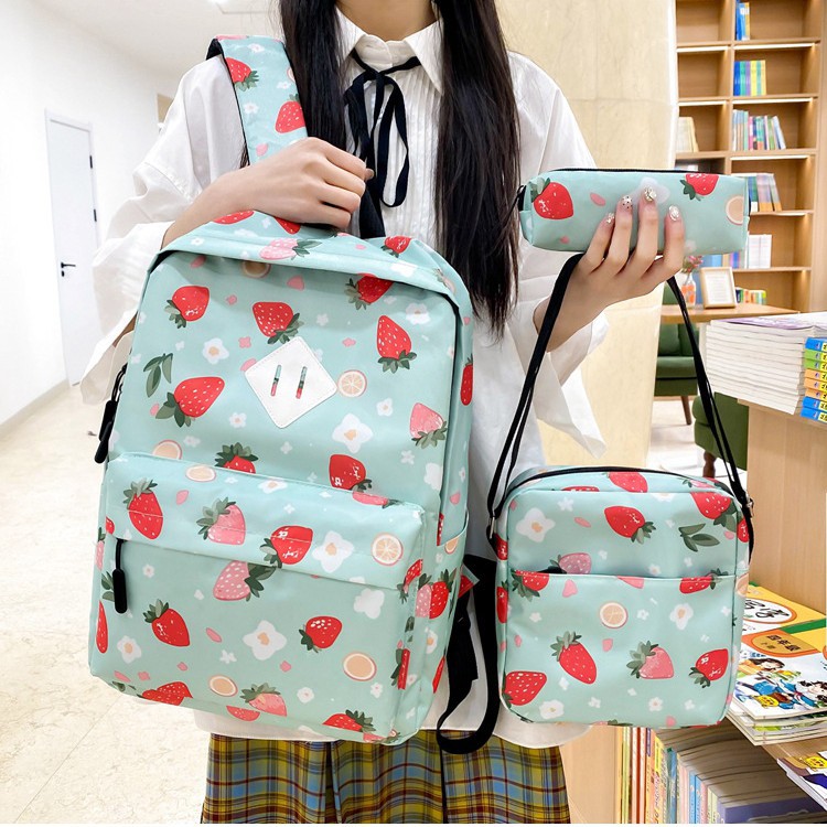 A new Korean-style versatile casual bag with a large capacity. It is a strawberry print backpack for primary, middle and high school students with a high level of appearance full figure