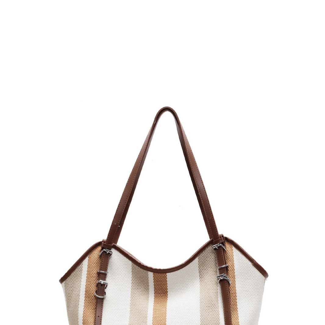 Large-capacity canvas striped bag for women, 2024 new style fashionable tote bag, versatile commuting large bag for autumn and winter, single-shoulder bag Item Picture