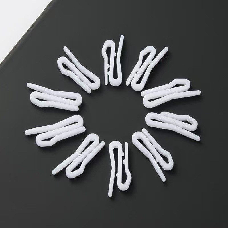 The manufacturer wholesals curtain hooks, small pointed hooks, curtain fabric tape hooks, white plastic hooks and curtain ring accessories details Picture