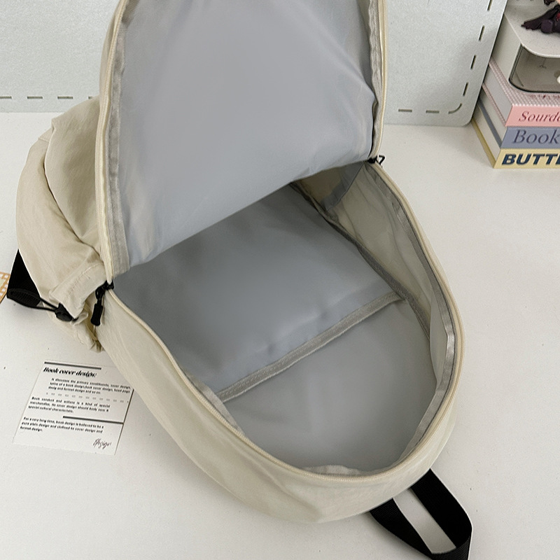 A lightweight college student backpack from a trendy Japanese Instagram brand, with a high level of appearance, simple and solid color design, and a versatile computer backpack Application Scenario