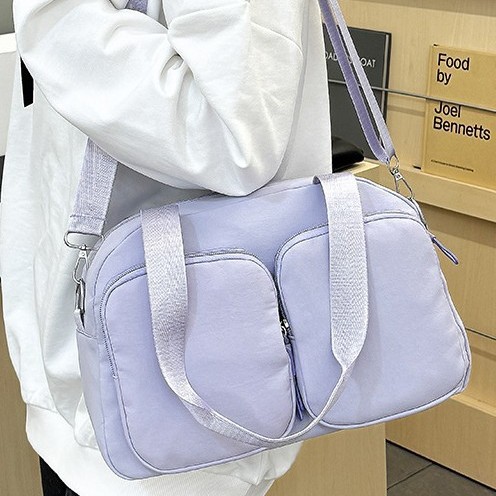 Korean version large-capacity hand-held versatile women's bag, travel bag, short-distance solid-color fashionable casual light shoulder bag, crossbody bag full figure
