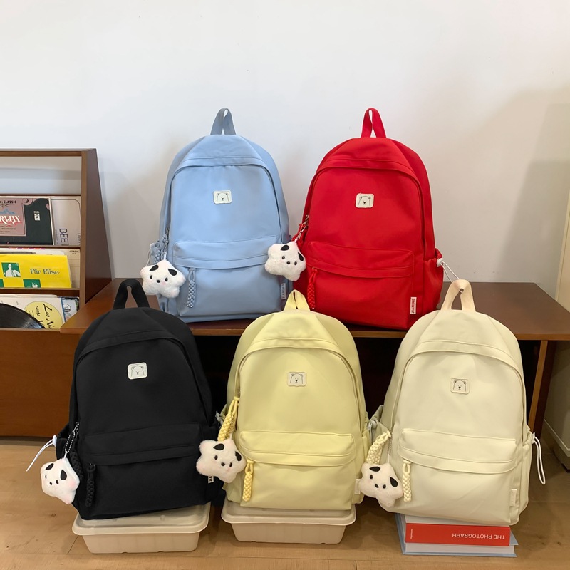 A new cross-border, niche, large-capacity, lightweight and simple Korean-style solid color large-capacity schoolbag suitable for both boys and girls in primary schools full figure