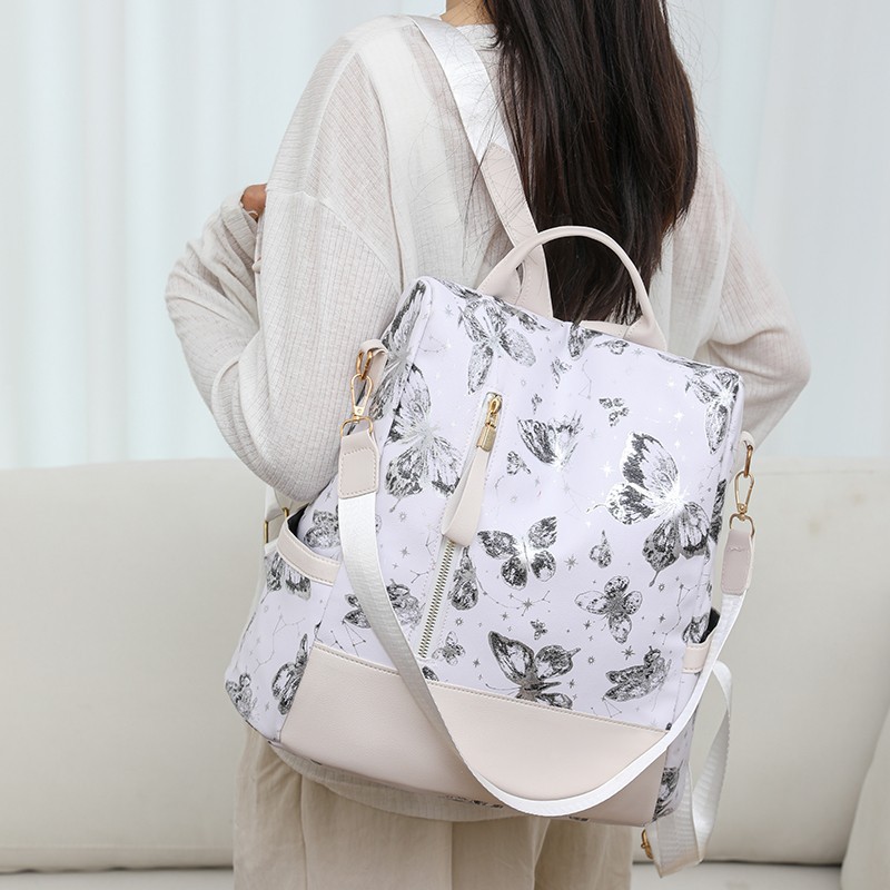 The new printed backpack is a fashionable large-capacity hand-held shoulder bag for women. It is a casual travel backpack and very cute details Picture