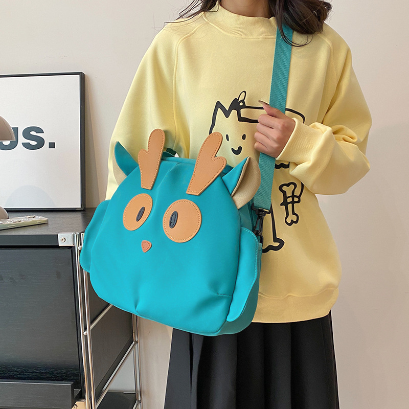 Cartoon large bag, funny cat for girls, large-capacity canvas bag for girls, niche design, single-shoulder crossbody bag for middle school students details Picture