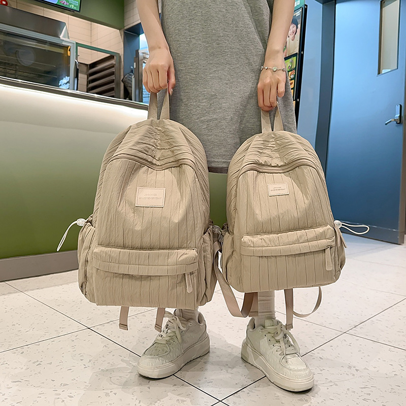 Solid-color cream large-capacity schoolbag, versatile student ins lightweight student backpack, forest-style girl travel backpack Application Scenario