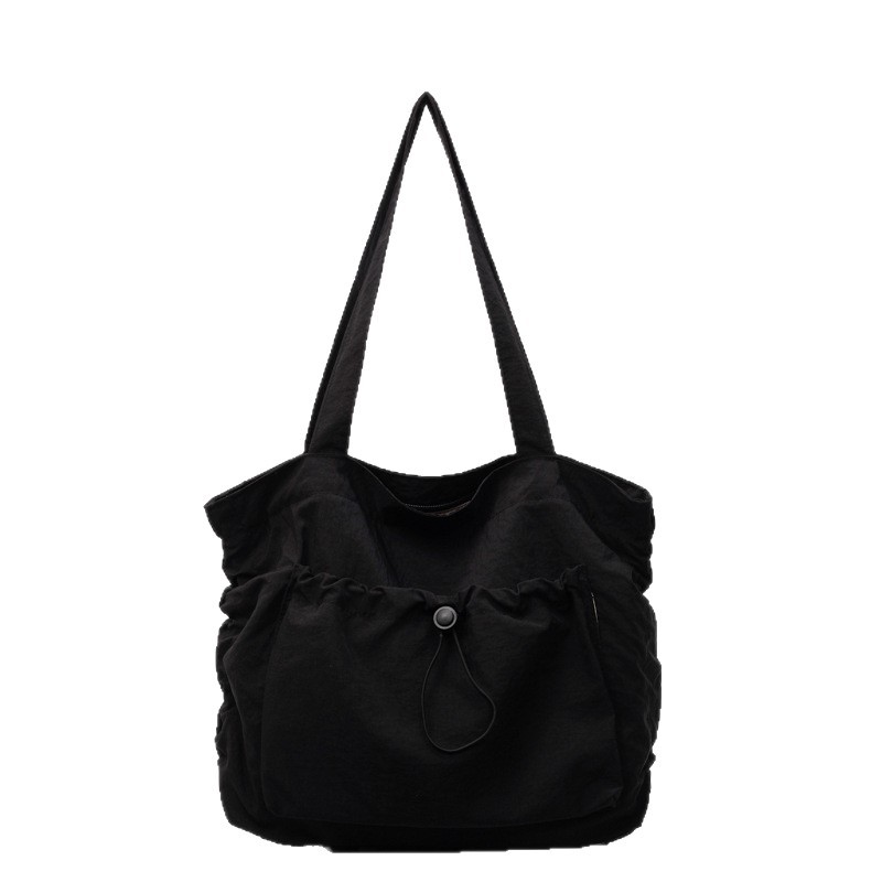 This is a new, minimalist and versatile single-shoulder bag for women with a unique canvas design. It is a large-capacity commuting bag for office workers Item Picture