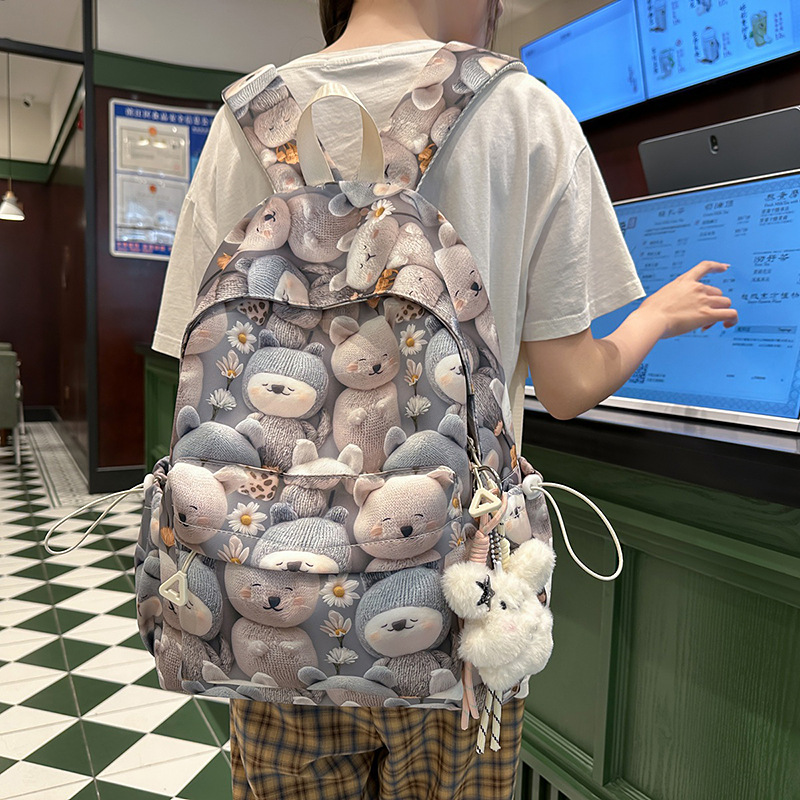 A new high-appeal, fresh, sweet and cute printed backpack for junior and senior high school students, a lightweight and large-capacity backpack for after-school tutoring details Picture