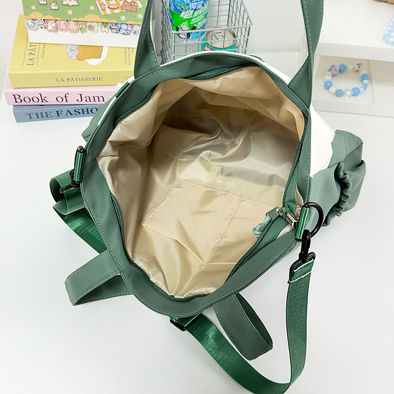 Large-capacity cartoon school-style single-shoulder bag for female primary school students to carry books for class tutoring. High appearance level student crossbody bag Application Scenario