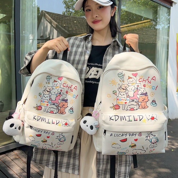 A Japanese-style Instagram niche graffiti schoolbag with high appearance standards, a cute and versatile backpack for junior high school girls, and a lightweight travel backpack full figure