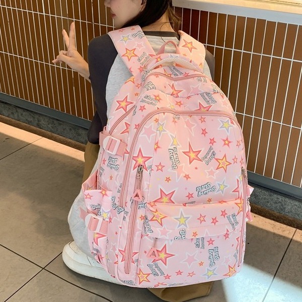 A Japanese-style inS-style schoolbag for a female junior high school student with a high level of appearance, a star-shaped backpack, and a cute graffiti backpack for primary school students details Picture